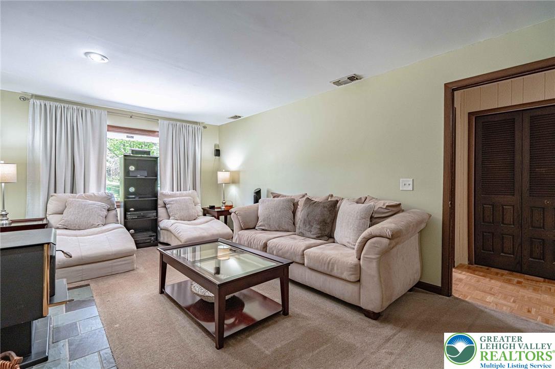 3857 Friedens Road Slatington, PA 18080 - Photo 22 of 75 This living room features recessed lighting and a classic design, creating an inviting space for relaxation.