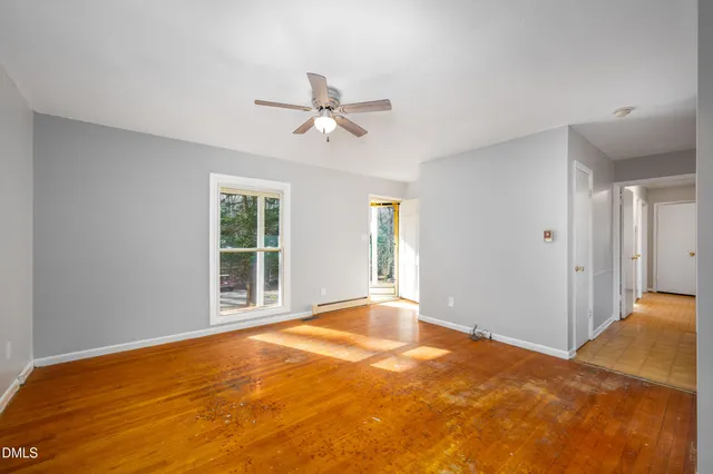 a view of an empty room with a window