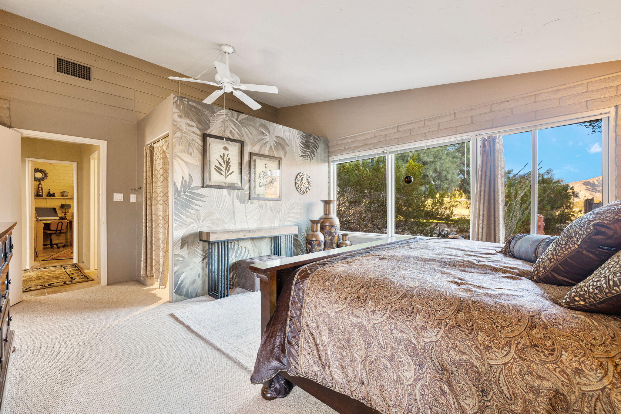 22950 Henry Road Desert Hot Springs, CA 92241 - Photo 17 of 68 a bedroom with a bed dresser and a large window