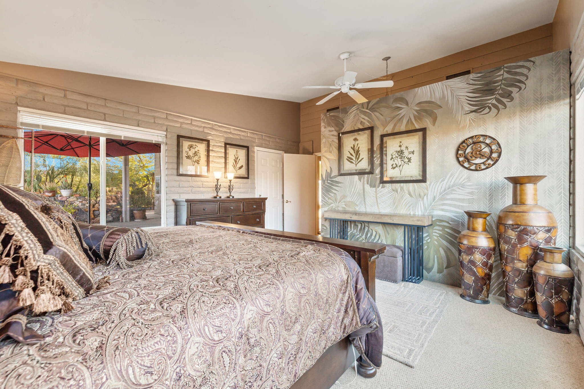 22950 Henry Road Desert Hot Springs, CA 92241 - Photo 18 of 68 a bedroom with a bed and dresser next to a window
