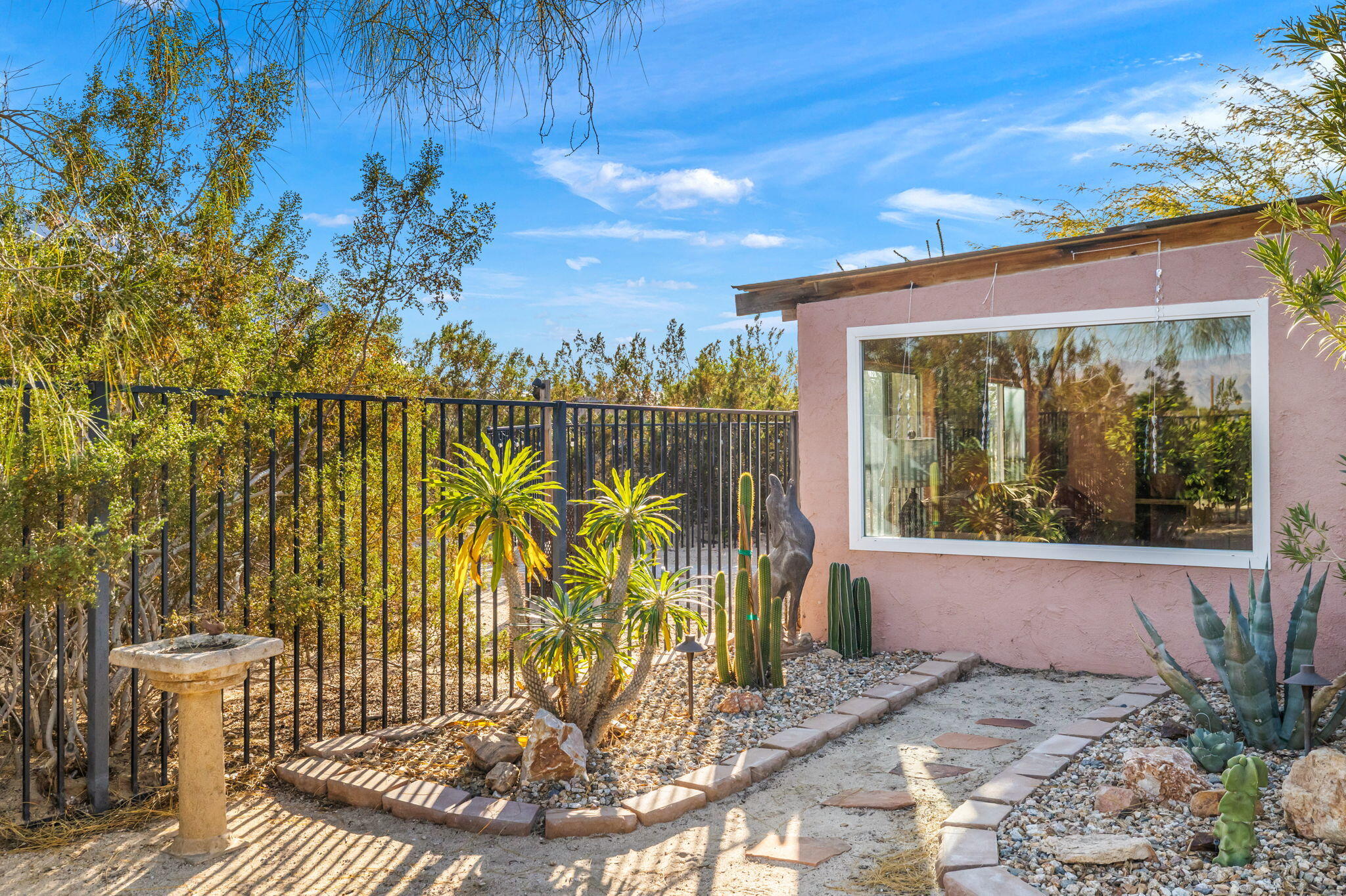 22950 Henry Road Desert Hot Springs, CA 92241 - Photo 35 of 68 a view of a door and chair in the patio