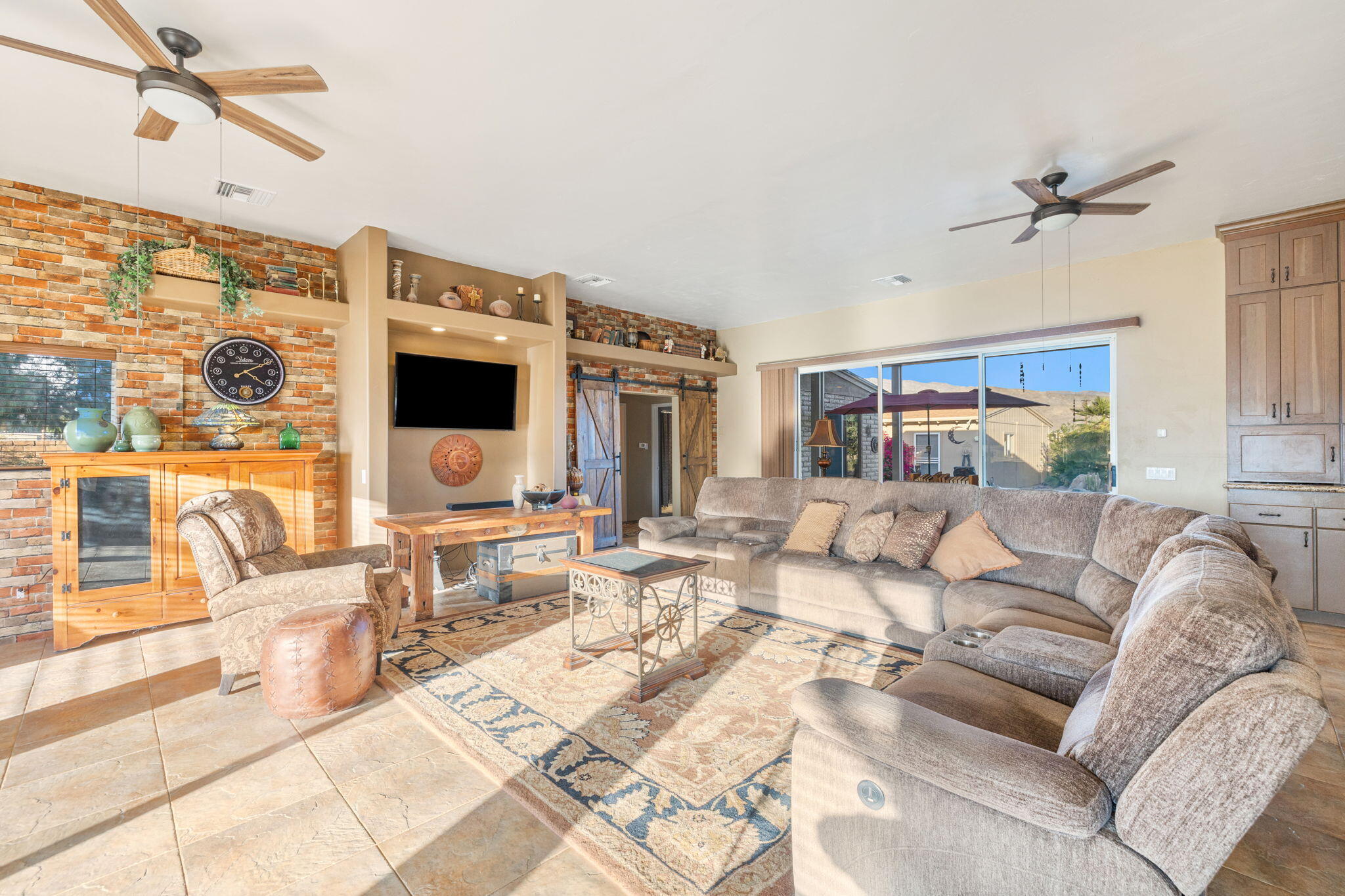 22950 Henry Road Desert Hot Springs, CA 92241 - Photo 4 of 68 a living room with furniture and a flat screen tv