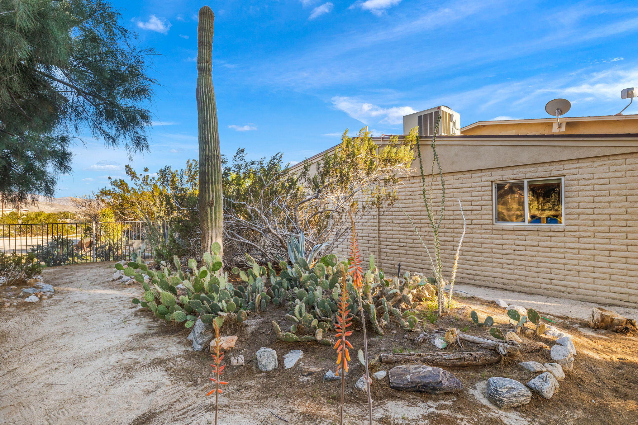 22950 Henry Road Desert Hot Springs, CA 92241 - Photo 59 of 68 a front view of a house with a yard