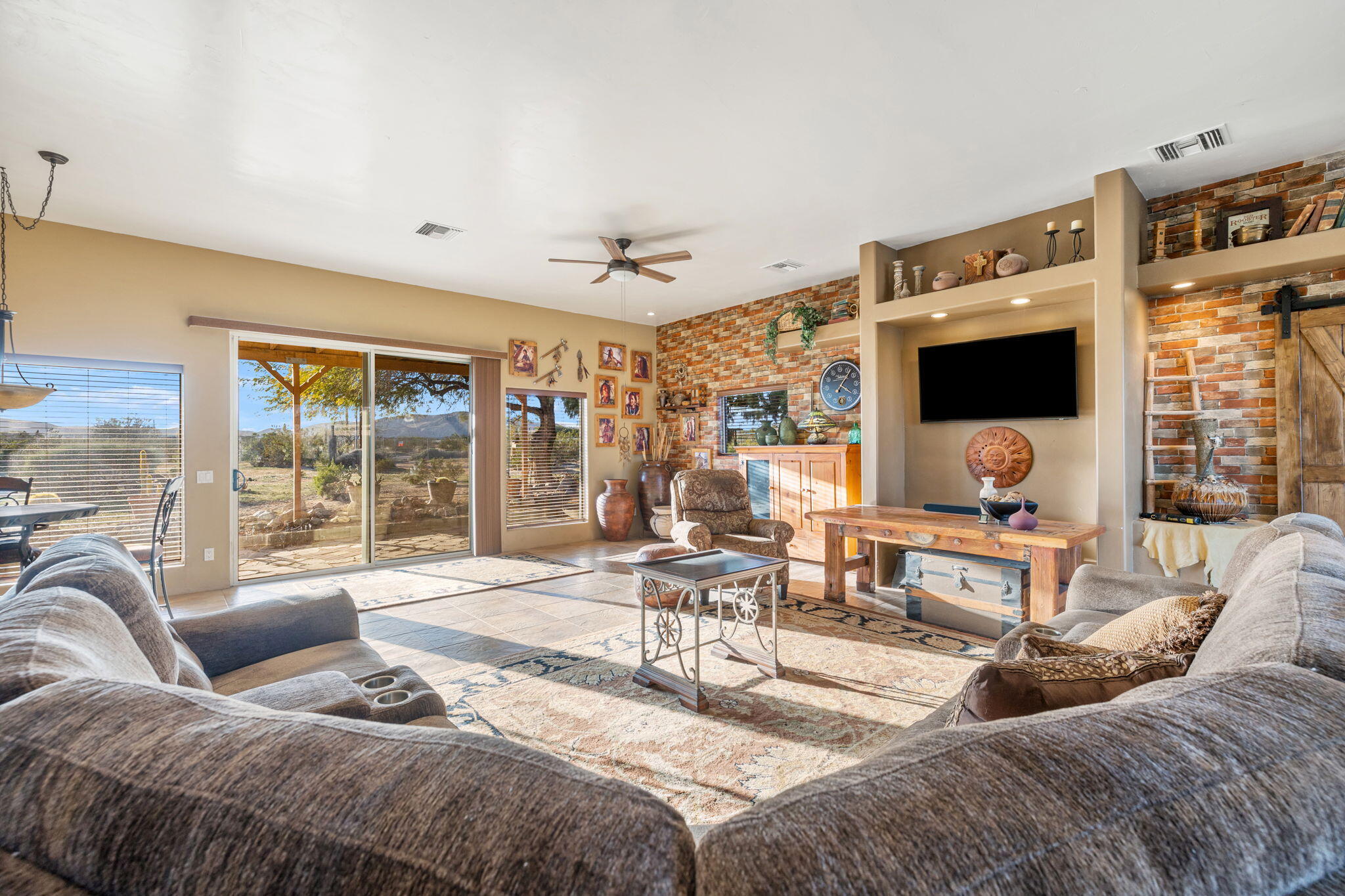 22950 Henry Road Desert Hot Springs, CA 92241 - Photo 7 of 68 a living room with furniture and a flat screen tv