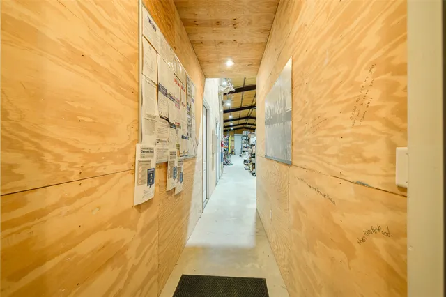 a kitchen with a stove a table and chairs in it