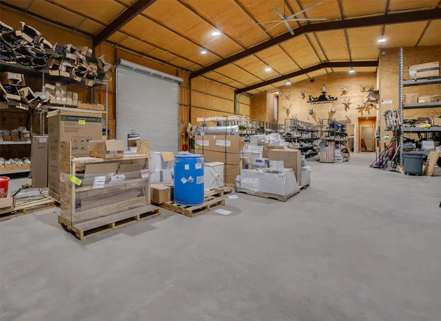 a backyard of a house with lots of green space and plants