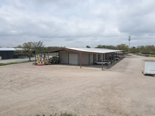 a view of a backyard with large trees
