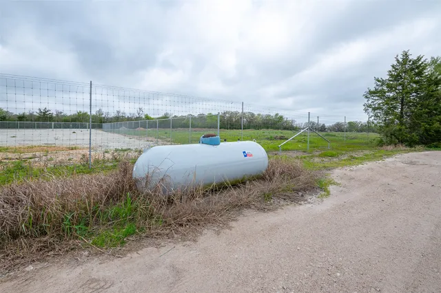 a bedroom with a bed and flat screen tv