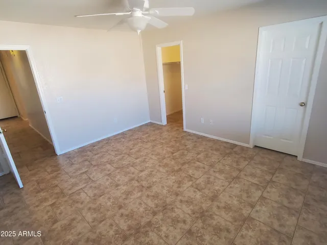 an empty room with an entryway door