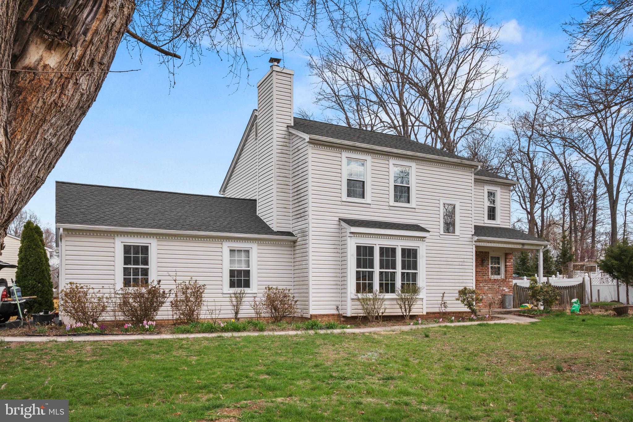 15123 Philip Lee Road Chantilly, VA 20151 - Photo 2 of 26 Charming home with lush green yard.