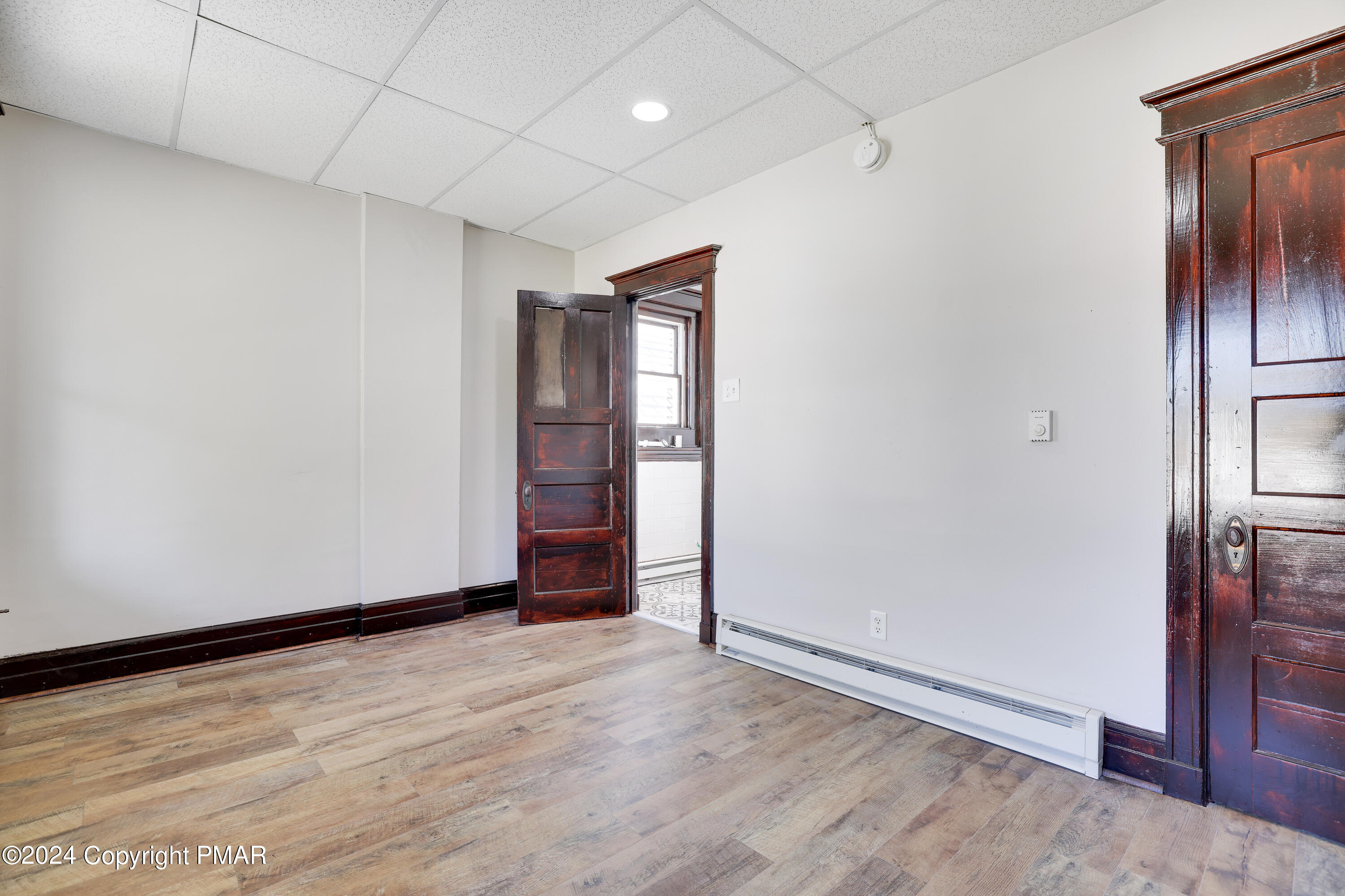 139 South Main Street Nazareth, PA 18064 - Photo 15 of 24 an empty room with wooden floor and windows