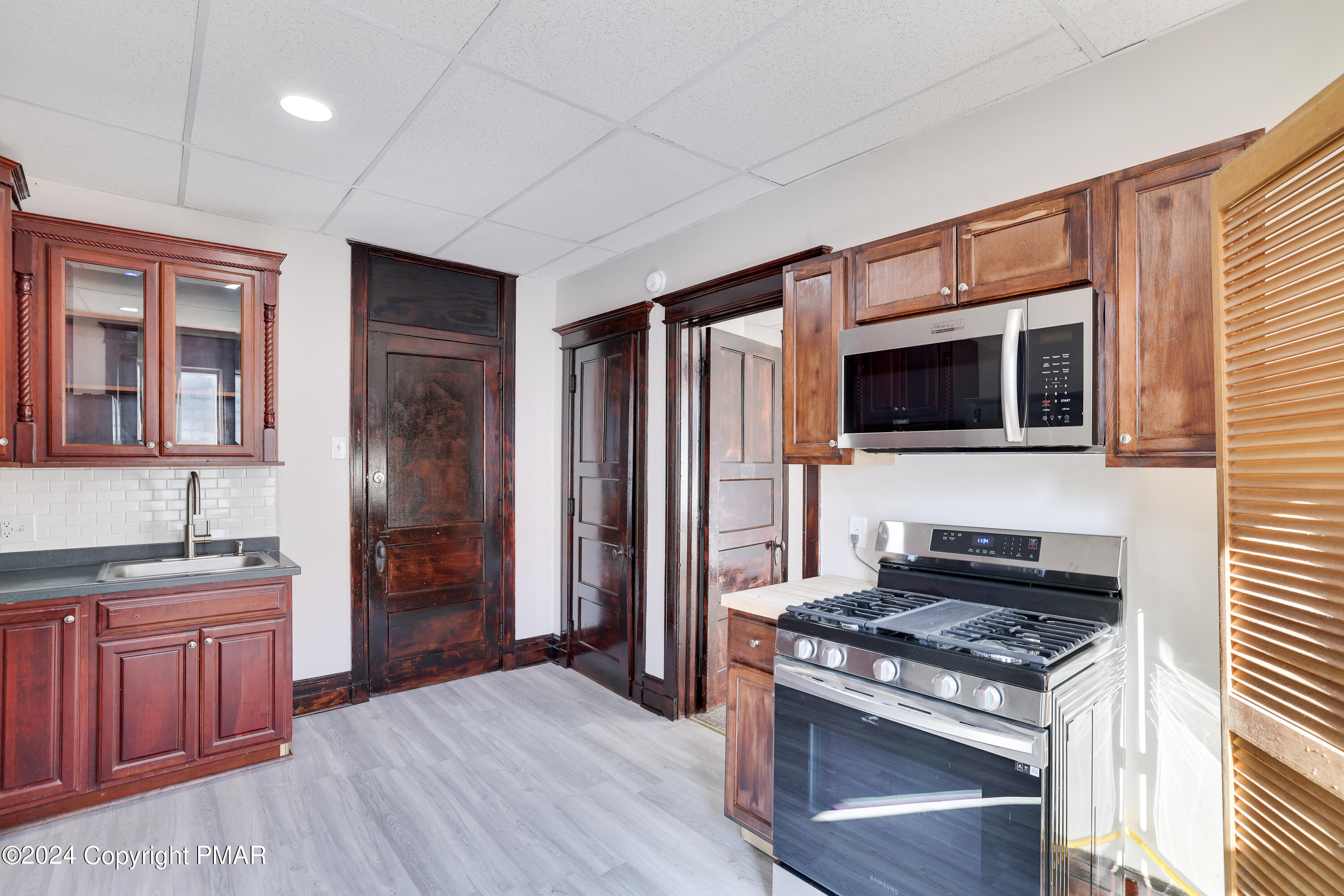 139 South Main Street Nazareth, PA 18064 - Photo 20 of 24 a kitchen with stainless steel appliances granite countertop a stove and a refrigerator