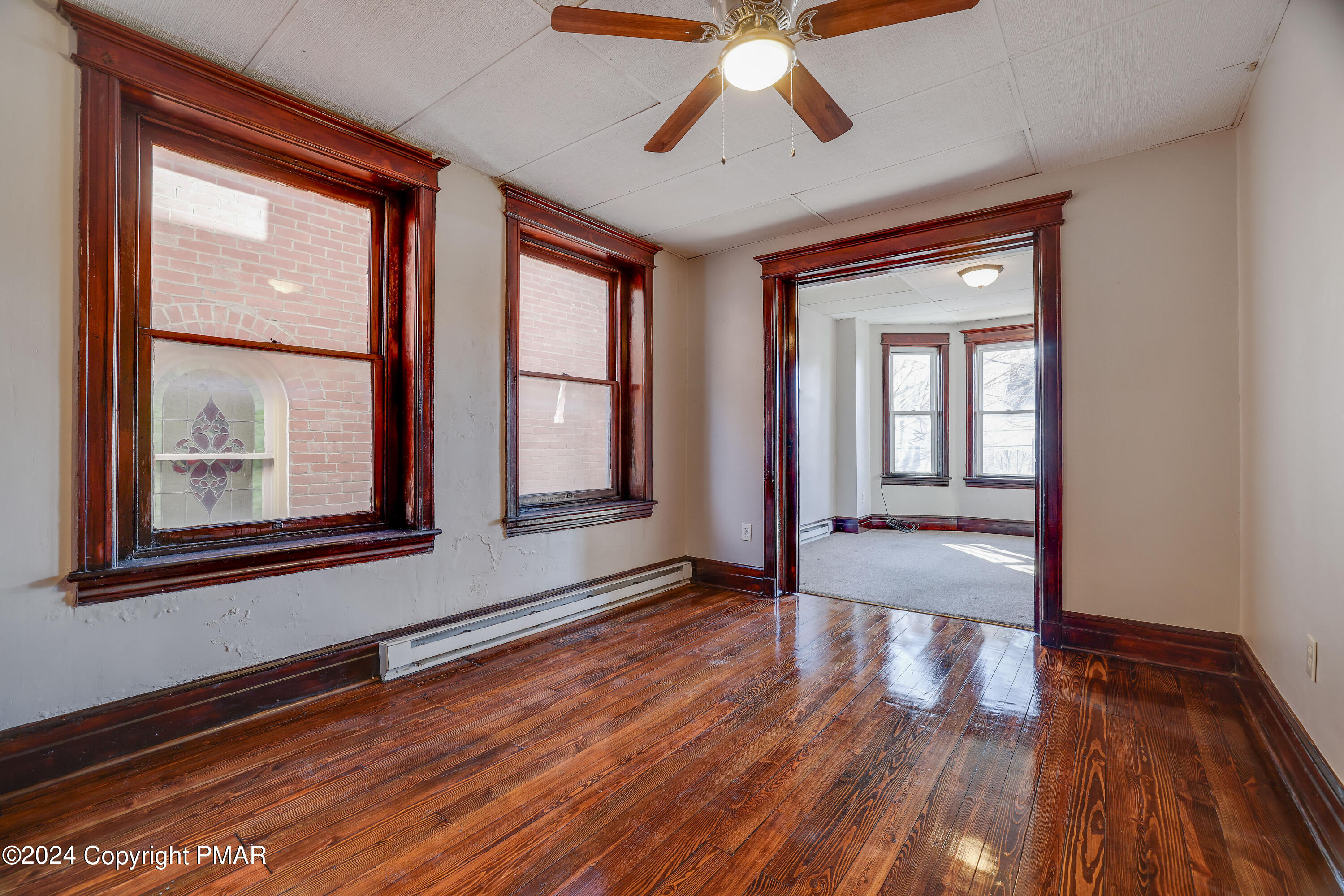 139 South Main Street Nazareth, PA 18064 - Photo 5 of 24 a view of an empty room with wooden floor and a window