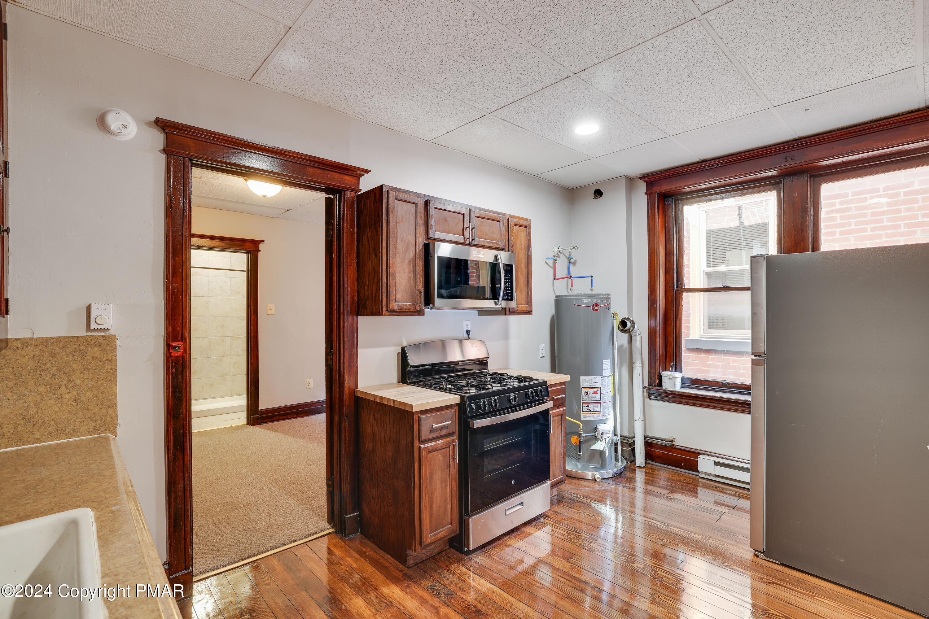 139 South Main Street Nazareth, PA 18064 - Photo 6 of 24 a kitchen with stainless steel appliances granite countertop a refrigerator stove and sink