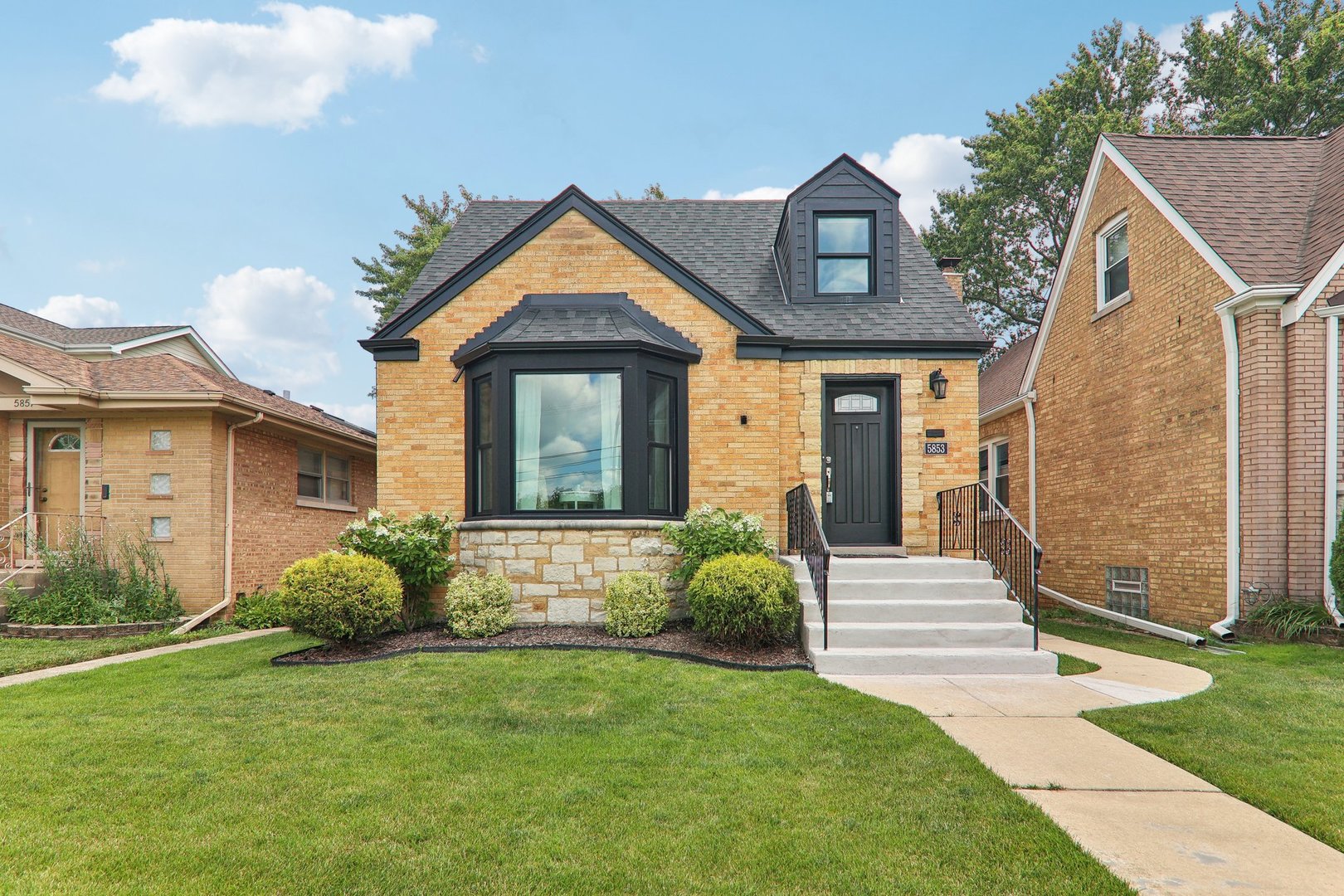 5853 North Central Avenue Chicago, IL 60646 - Photo 1 of 31 a front view of a house with a yard
