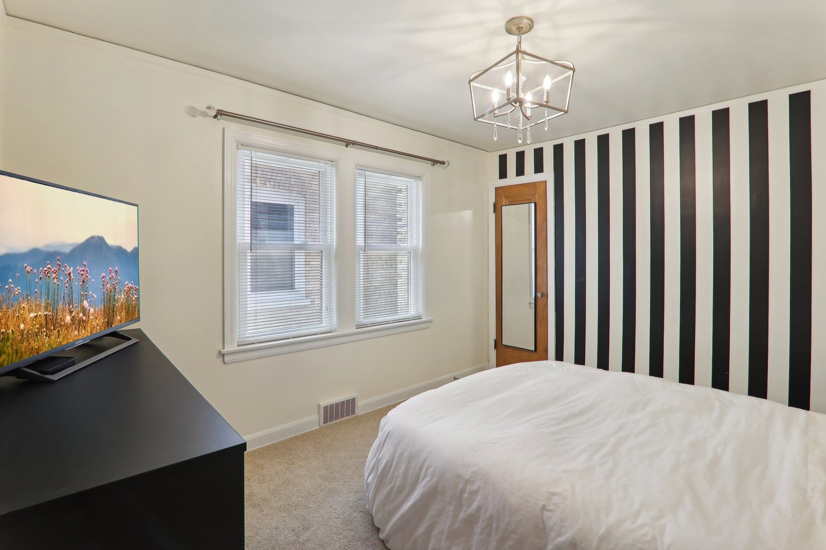 5853 North Central Avenue Chicago, IL 60646 - Photo 12 of 31 a bedroom with bed and a window
