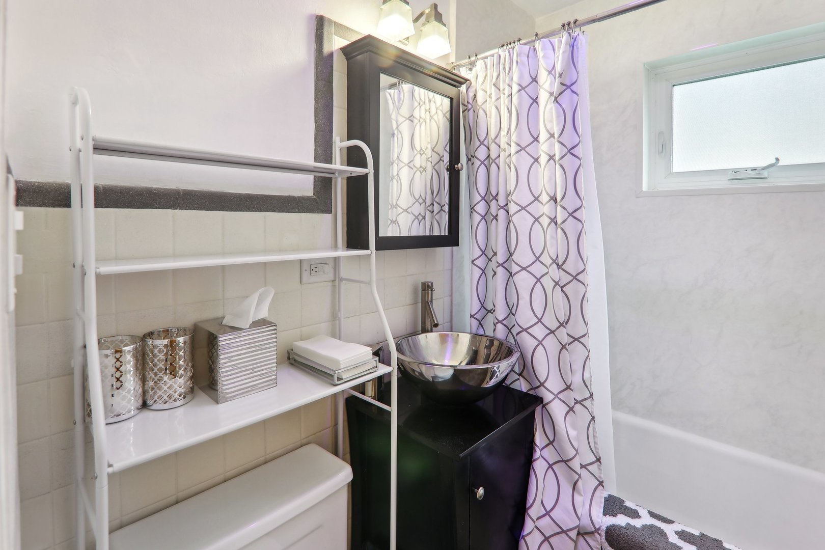 5853 North Central Avenue Chicago, IL 60646 - Photo 14 of 31 a bathroom with a bathtub and shower