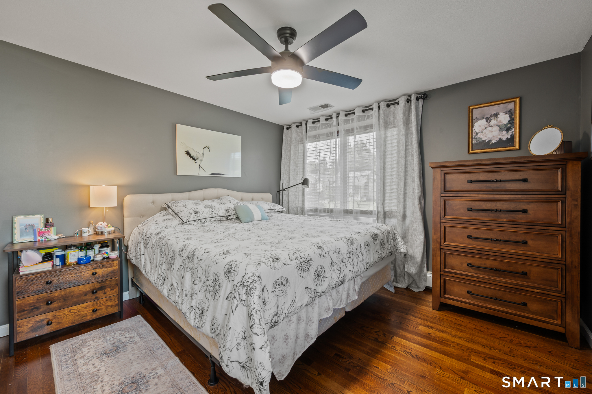 201 Ridge Crest Circle Wethersfield, CT 06109 - Photo 17 of 35 a bedroom with a bed and a chandelier