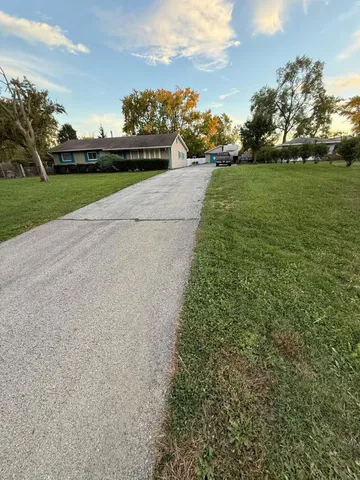 a view of grassy field with mountain
