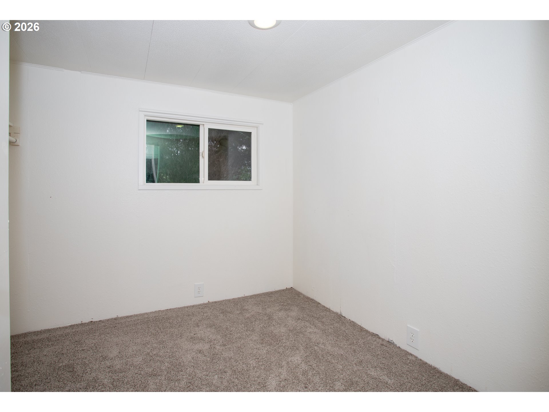5170 Grand Avenue, Unit 38 Florence, OR 97439 - Photo 18 of 27 a view of an empty room