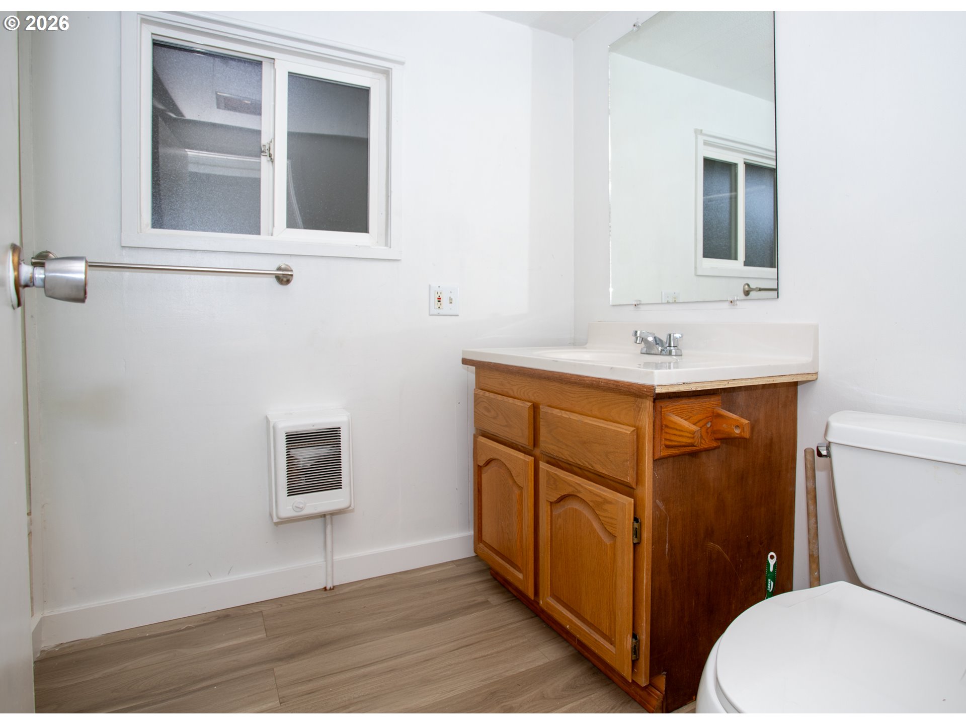 5170 Grand Avenue, Unit 38 Florence, OR 97439 - Photo 19 of 27 a bathroom with a toilet sink and mirror