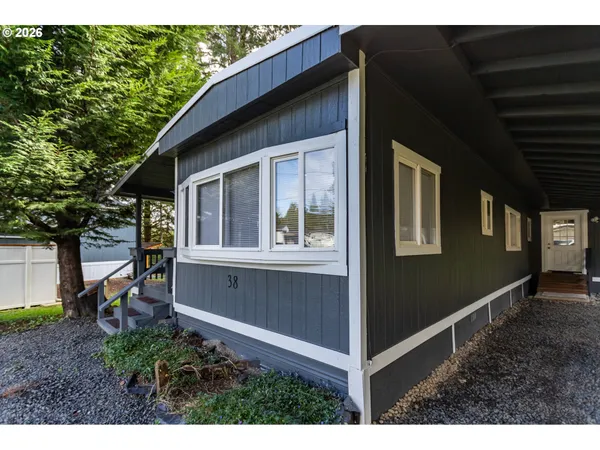 a view of house with backyard