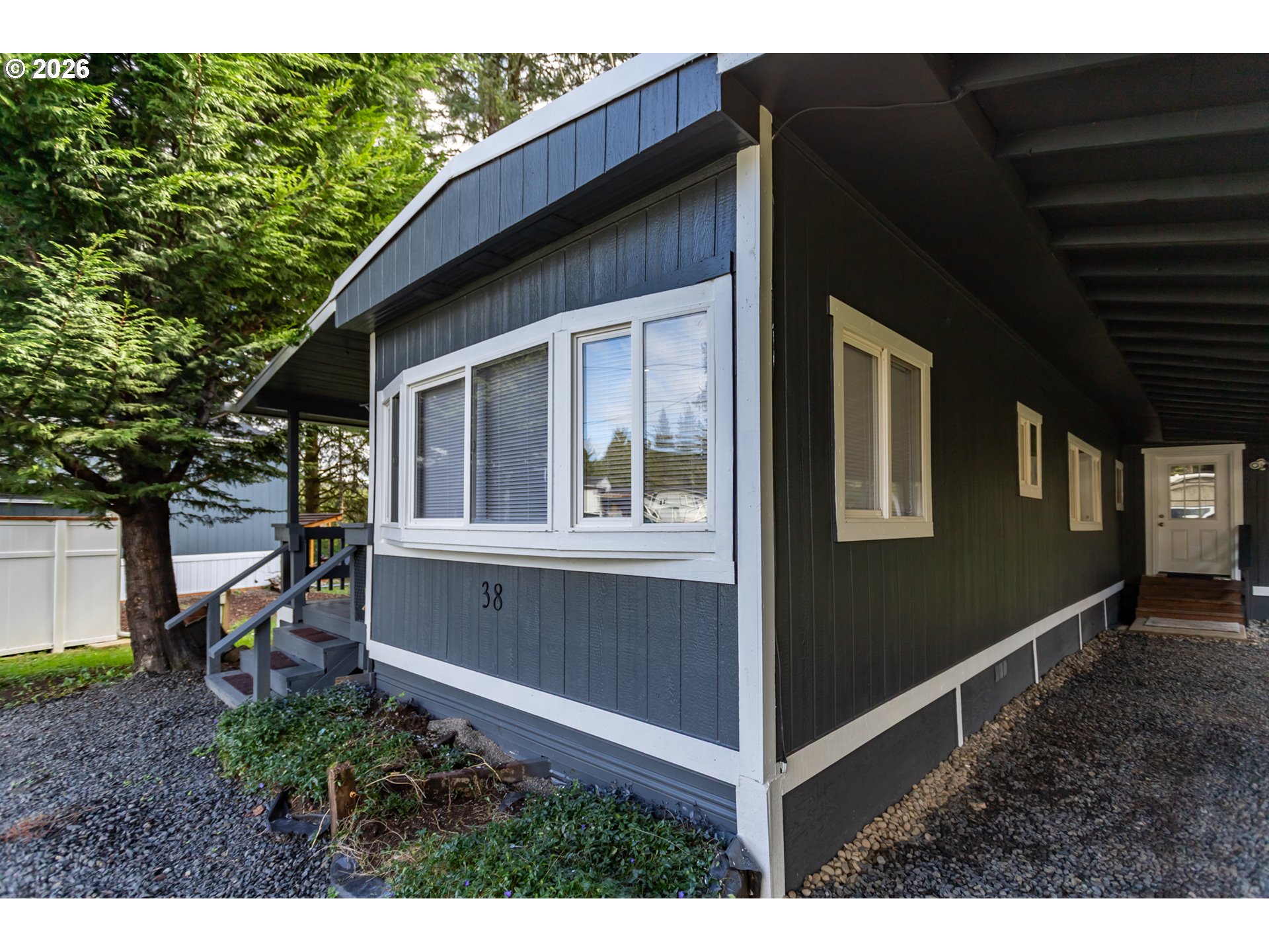 5170 Grand Avenue, Unit 38 Florence, OR 97439 - Photo 27 of 27 a view of house with backyard