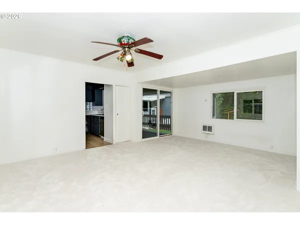 a view of an empty room with a window