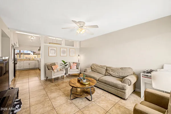 a living room with furniture and a rug