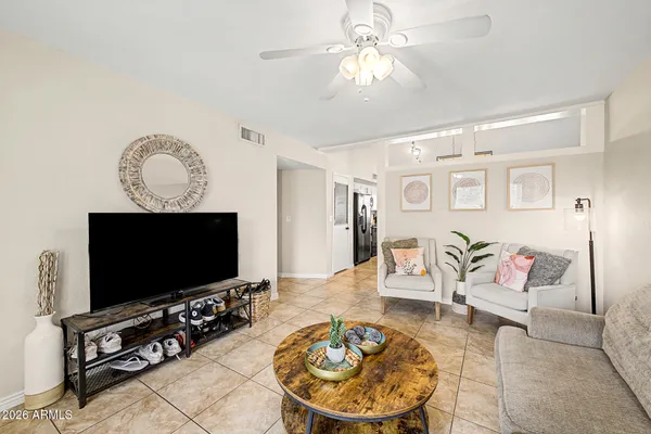 a living room with furniture and a flat screen tv
