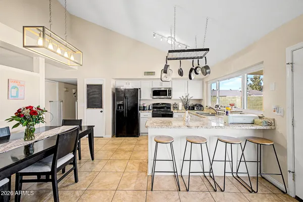 a kitchen with a refrigerator a sink and dishwasher