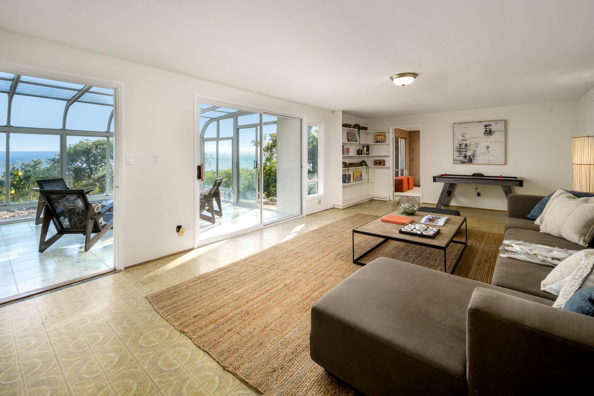929 Arbolado Road Santa Barbara, CA 93103 - Photo 23 of 29 a living room with furniture and a window