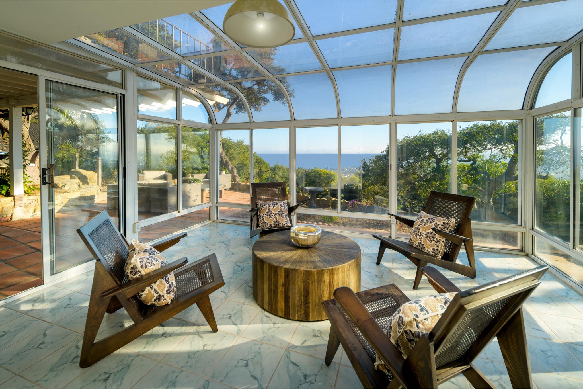 929 Arbolado Road Santa Barbara, CA 93103 - Photo 24 of 29 a living room with patio furniture and a floor to ceiling window