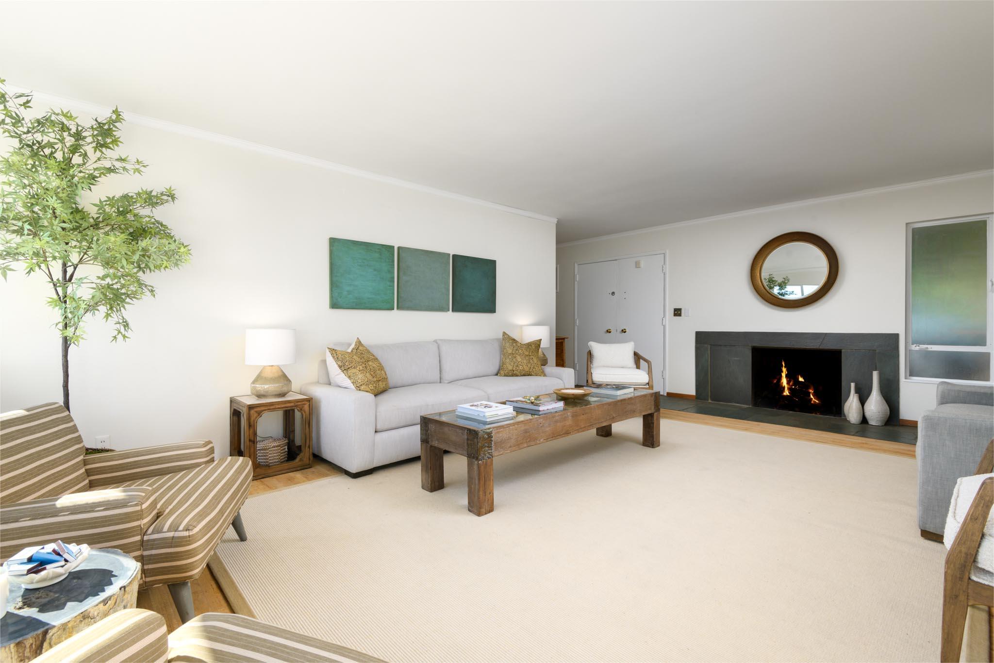 929 Arbolado Road Santa Barbara, CA 93103 - Photo 28 of 29 a living room with furniture and a fireplace