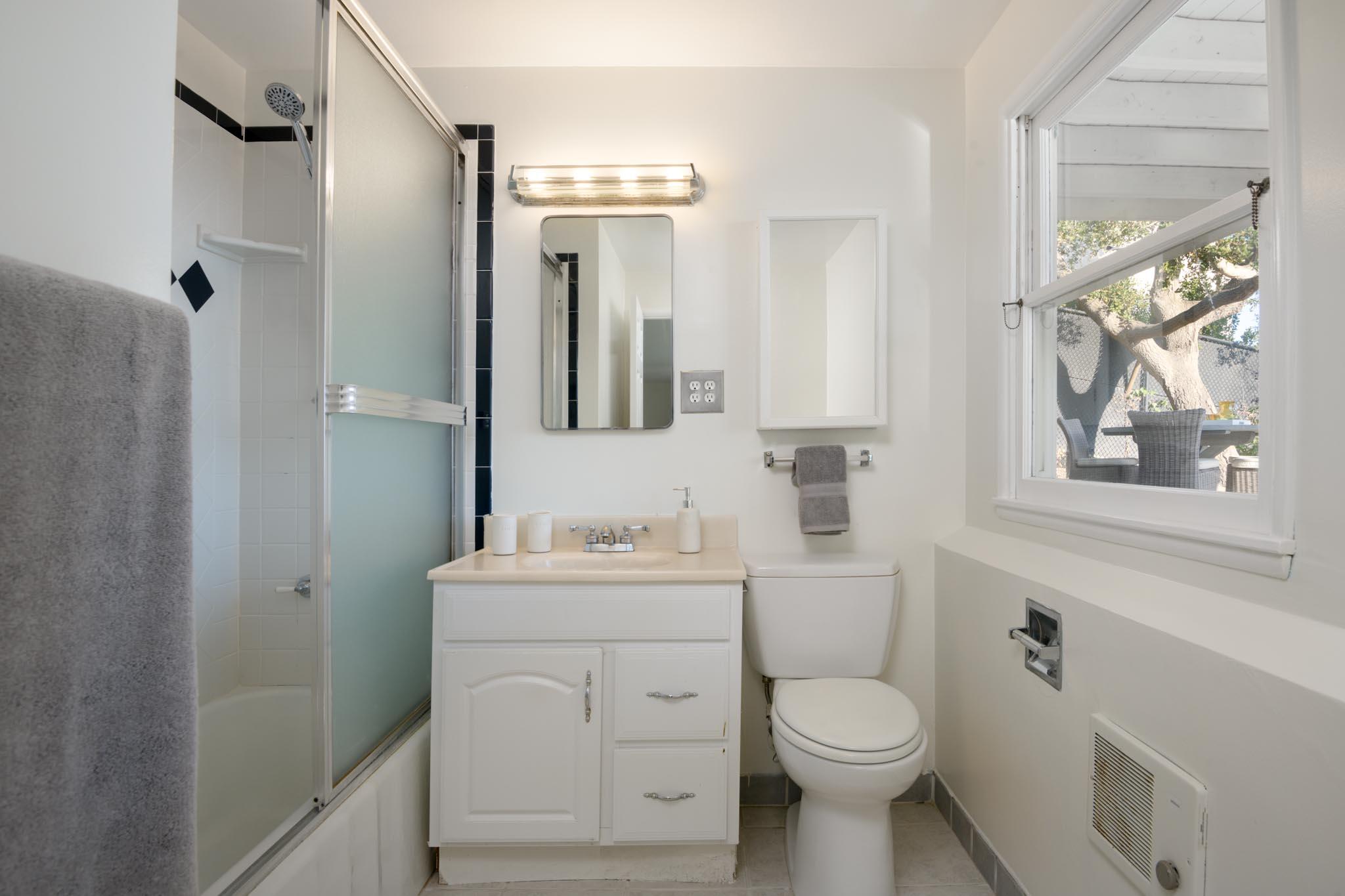 929 Arbolado Road Santa Barbara, CA 93103 - Photo 29 of 29 a bathroom with a toilet sink and mirror