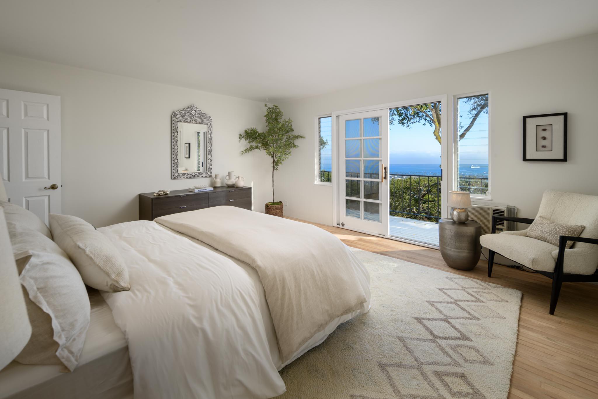 929 Arbolado Road Santa Barbara, CA 93103 - Photo 7 of 29 a bedroom with a large bed and a couch