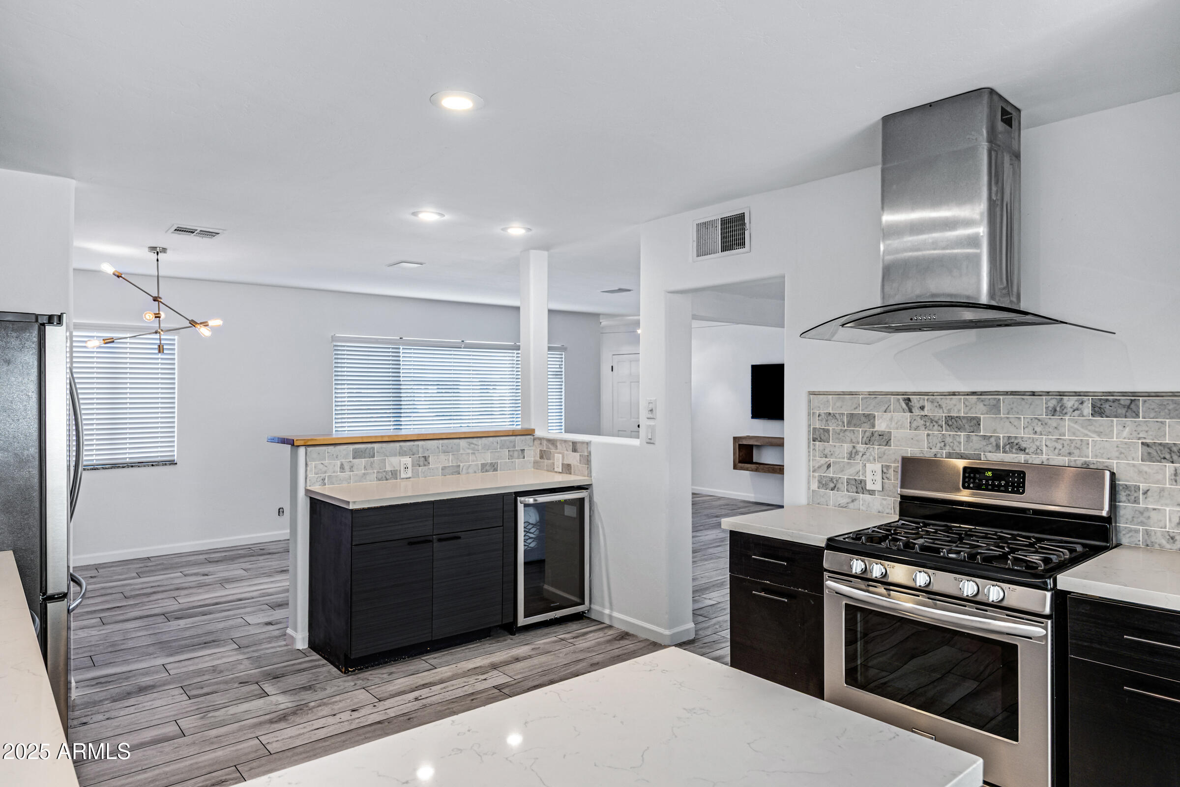 6829 East Almeria Road Scottsdale, AZ 85257 - Photo 12 of 35 a kitchen with a stove and a refrigerator