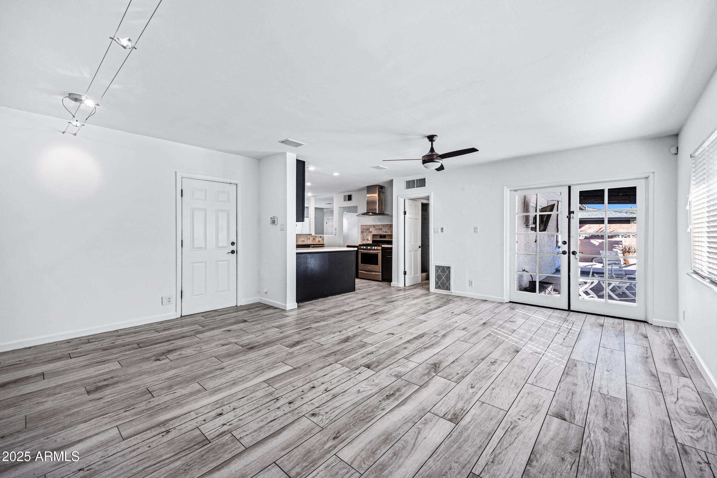 6829 East Almeria Road Scottsdale, AZ 85257 - Photo 14 of 35 a view of a livingroom with wooden floor