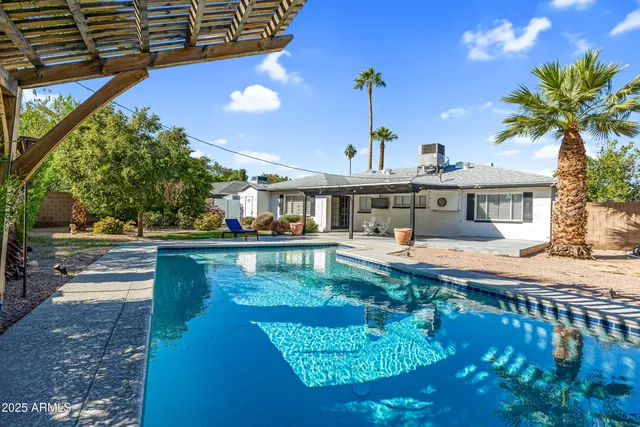 a view of a house with swimming pool
