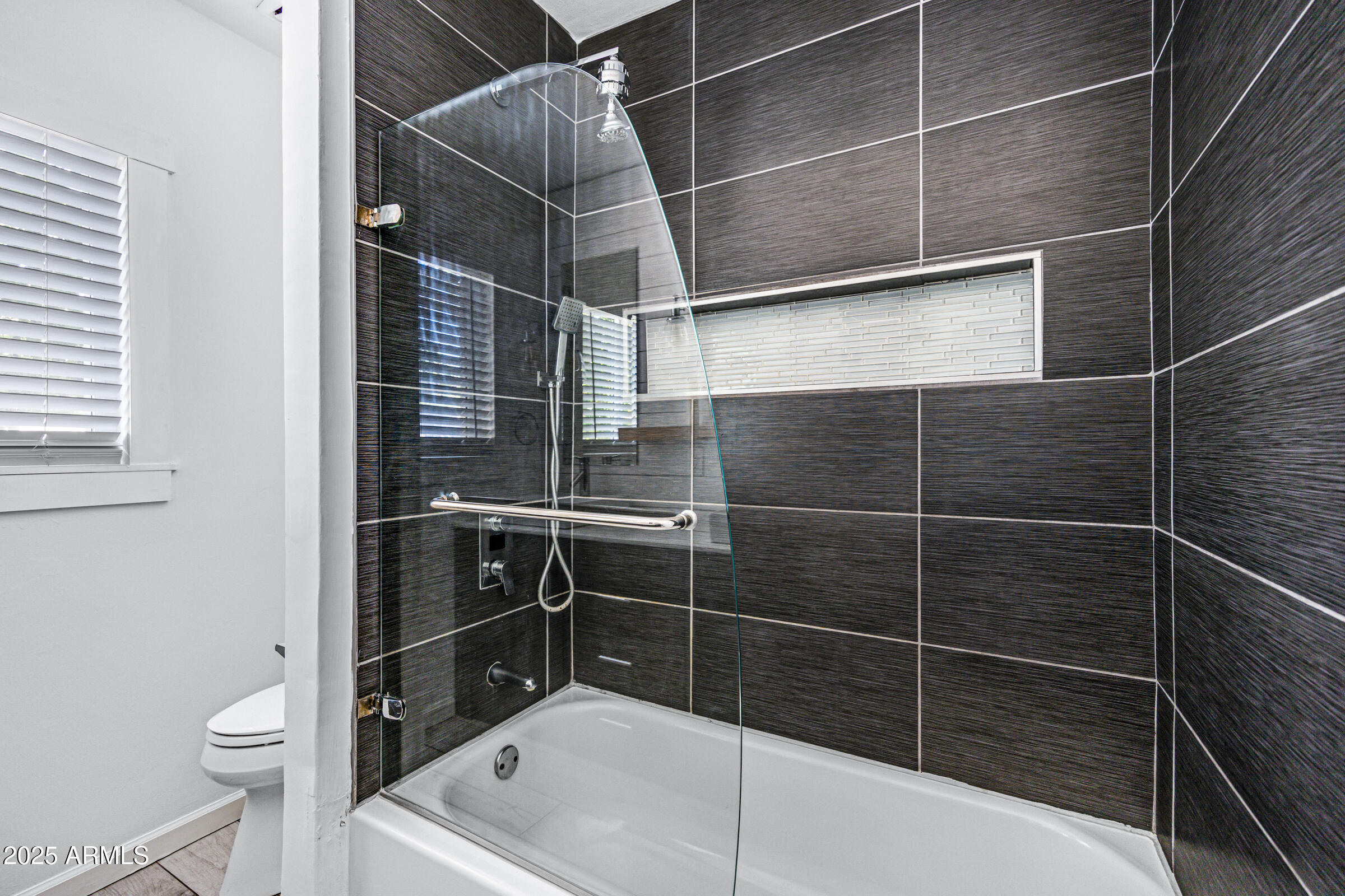 6829 East Almeria Road Scottsdale, AZ 85257 - Photo 21 of 35 a bathroom with a toilet and shower