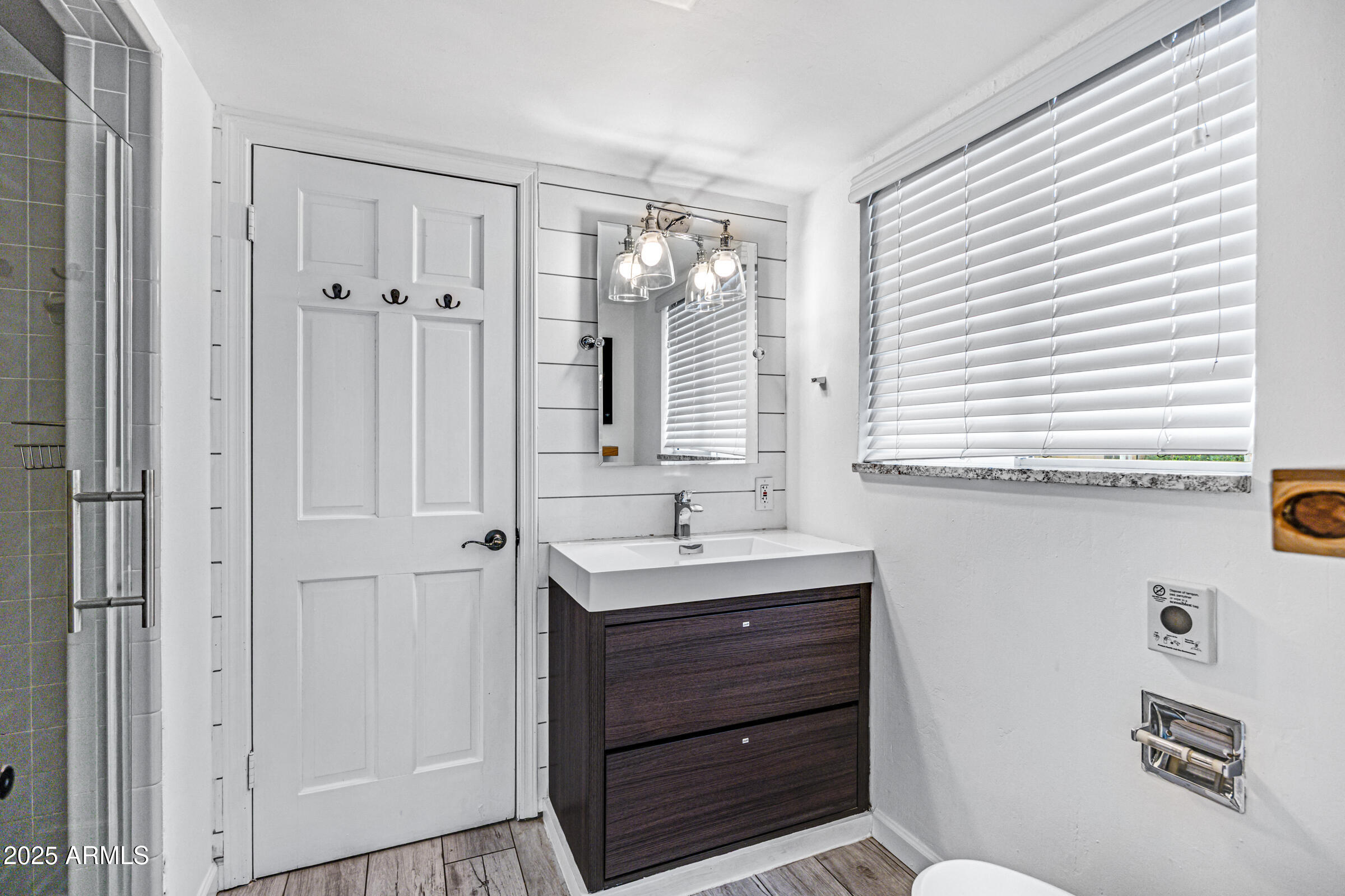 6829 East Almeria Road Scottsdale, AZ 85257 - Photo 24 of 35 a bathroom with a sink a toilet and a window