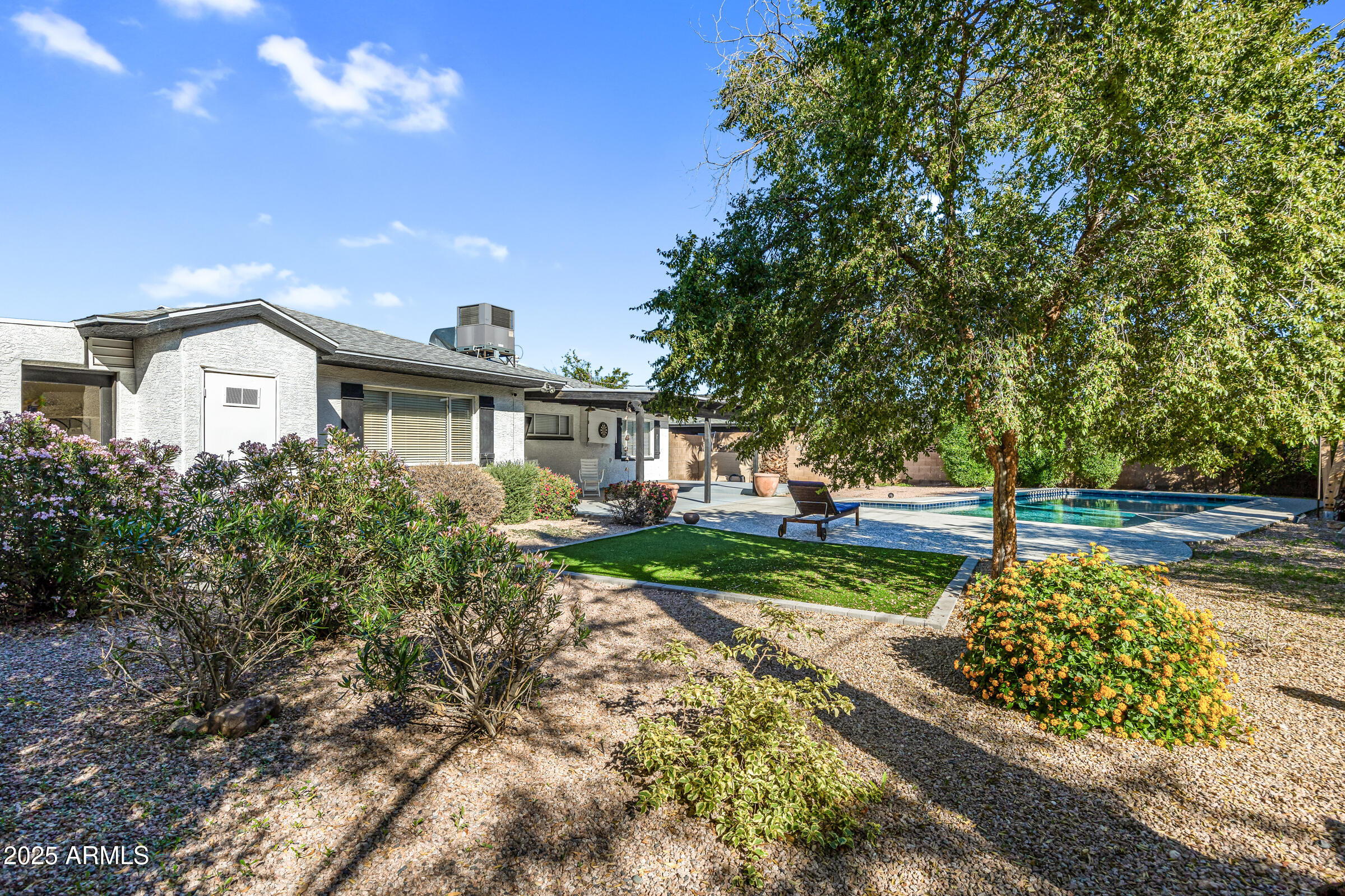 6829 East Almeria Road Scottsdale, AZ 85257 - Photo 29 of 35 a front view of a house with a yard