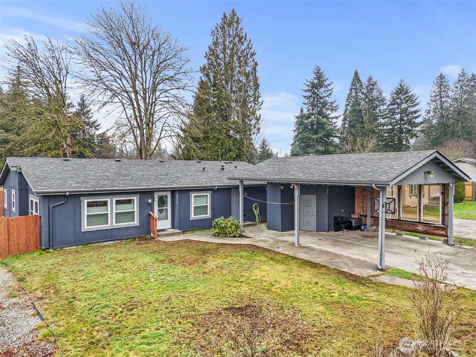 4416 South 315th Street Auburn, WA 98001 - Photo 1 of 37 a front view of a house with a yard table and chairs