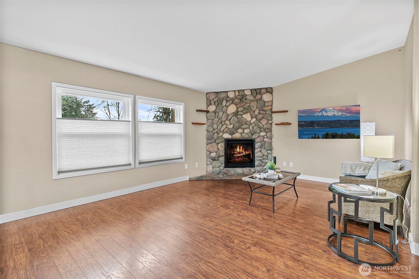 4416 South 315th Street Auburn, WA 98001 - Photo 12 of 37 a living room with furniture a fireplace and a table