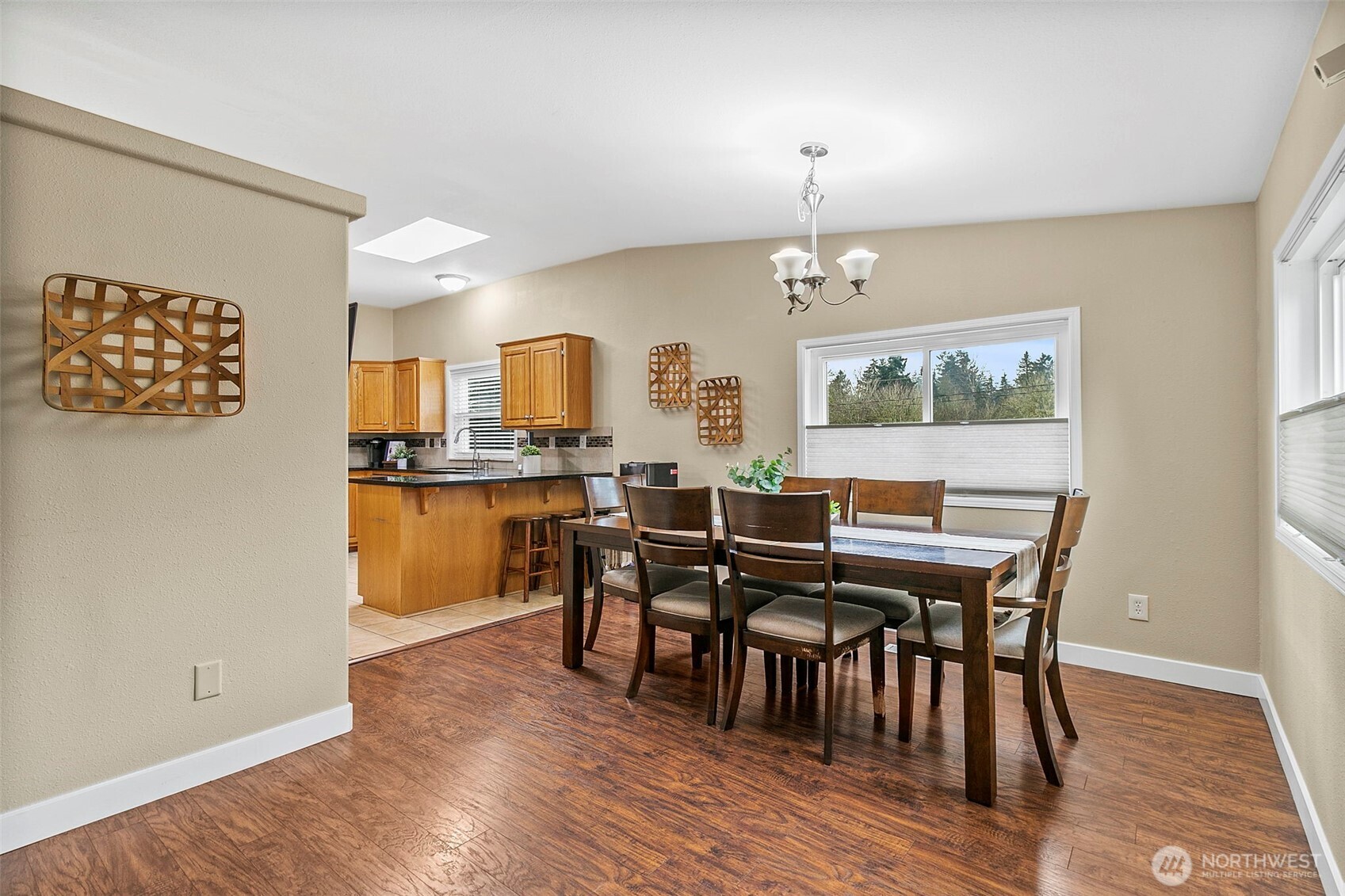 4416 South 315th Street Auburn, WA 98001 - Photo 17 of 37 a view of a dining room with furniture and wooden floor