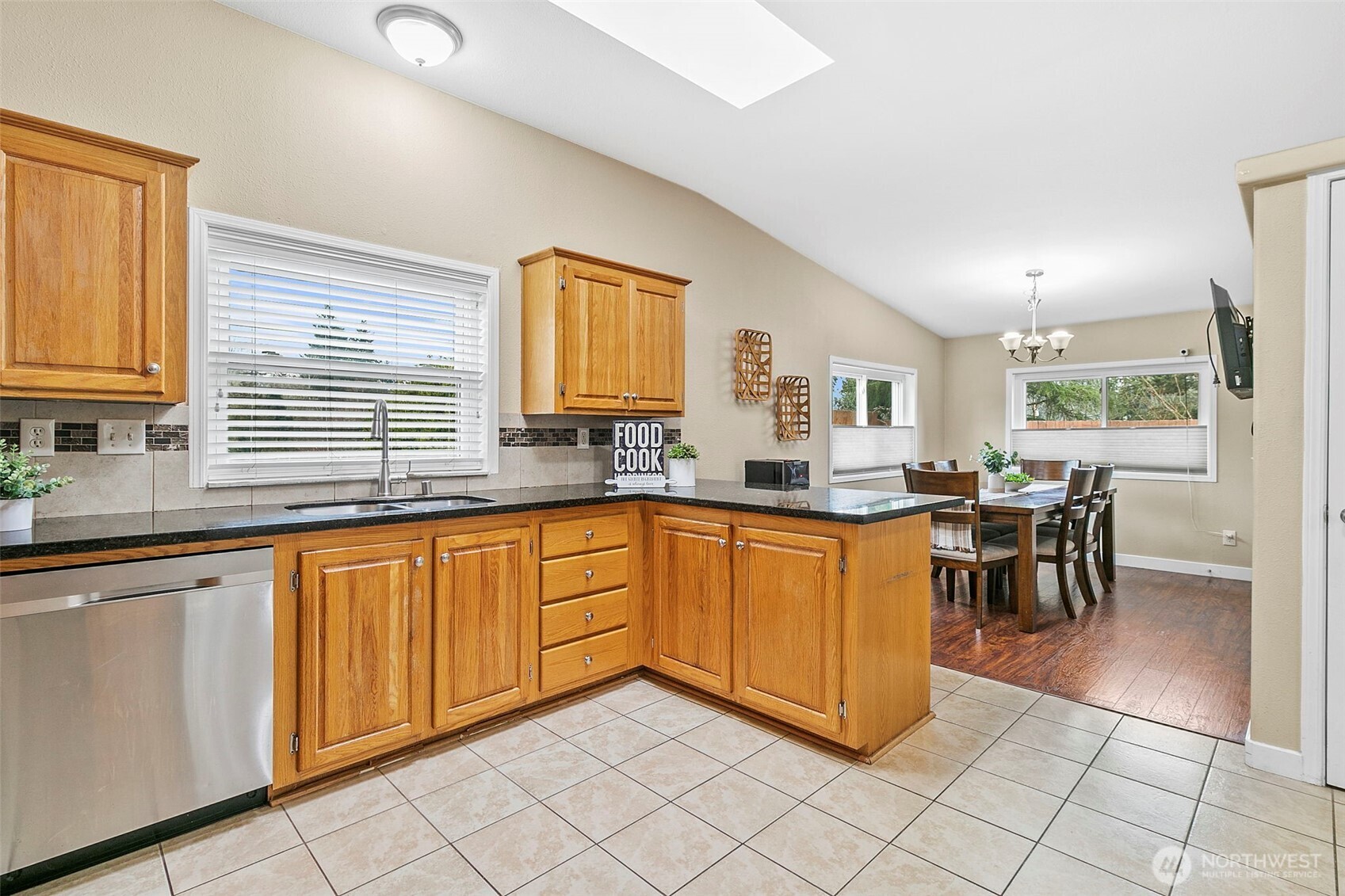 4416 South 315th Street Auburn, WA 98001 - Photo 22 of 37 a kitchen with stainless steel appliances granite countertop sink window and cabinets