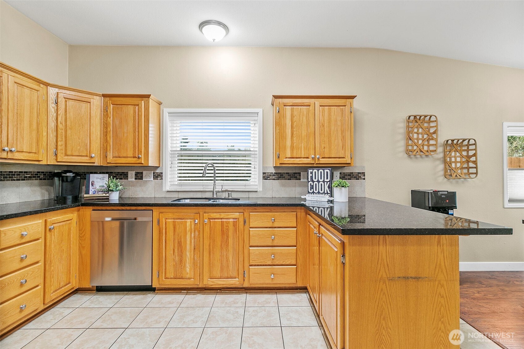 4416 South 315th Street Auburn, WA 98001 - Photo 24 of 37 a kitchen with stainless steel appliances granite countertop a sink stove and cabinets