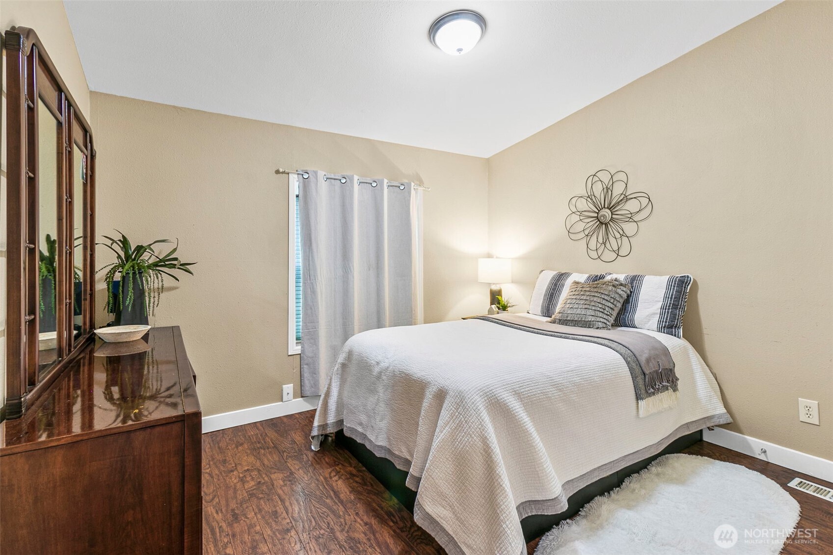 4416 South 315th Street Auburn, WA 98001 - Photo 26 of 37 a bedroom with a bed and a flat screen tv