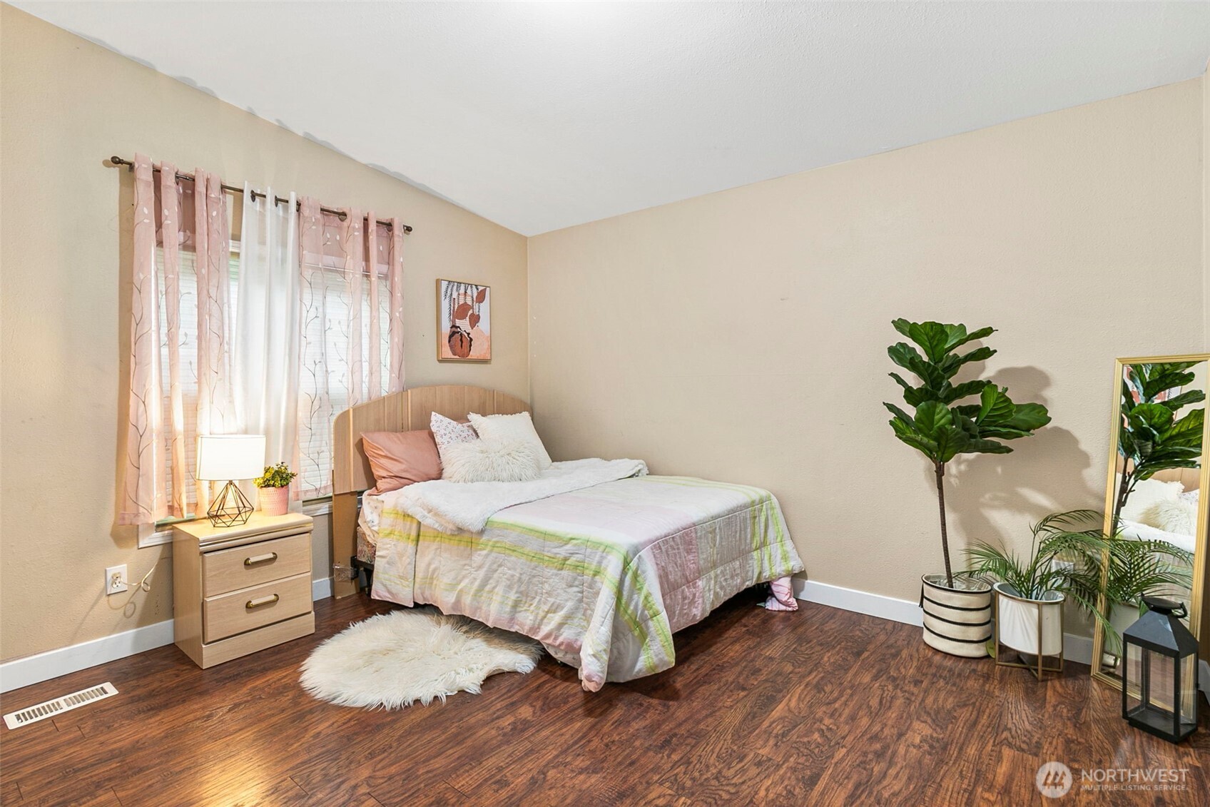 4416 South 315th Street Auburn, WA 98001 - Photo 28 of 37 a bedroom with a bed and a potted plant