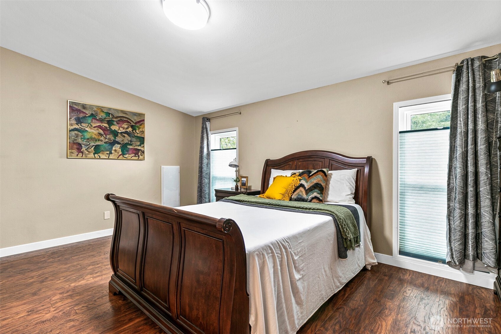 4416 South 315th Street Auburn, WA 98001 - Photo 30 of 37 a bedroom with a bed and wooden floor